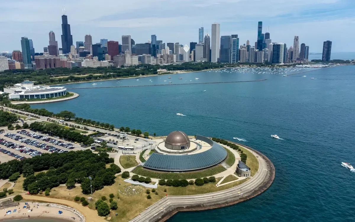 Chicago skyline and Adler Planetarium on a clear day.