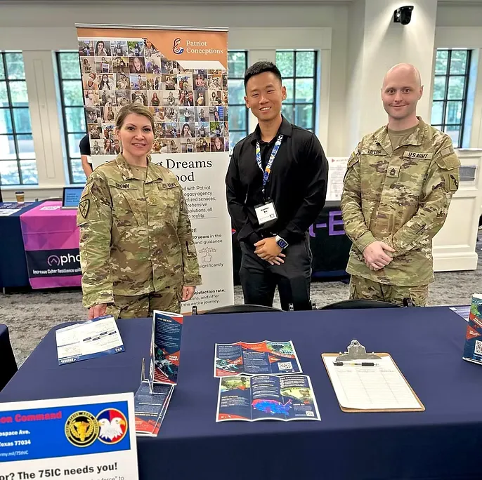 Patriot Conceptions team at an event booth