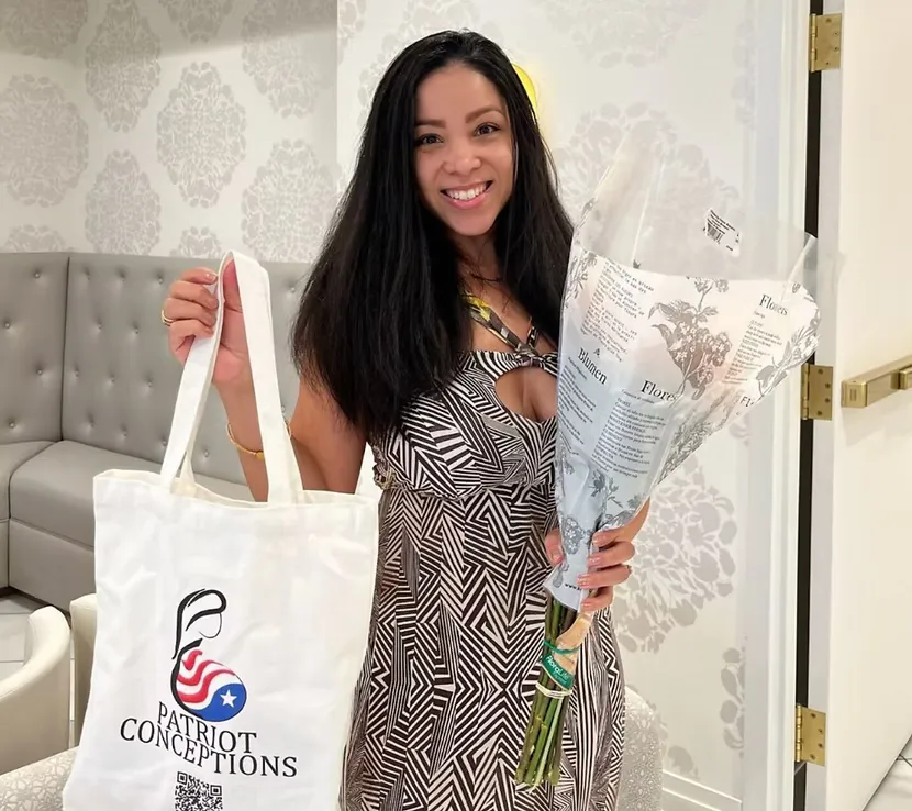 Egg donor with flowers and program materials