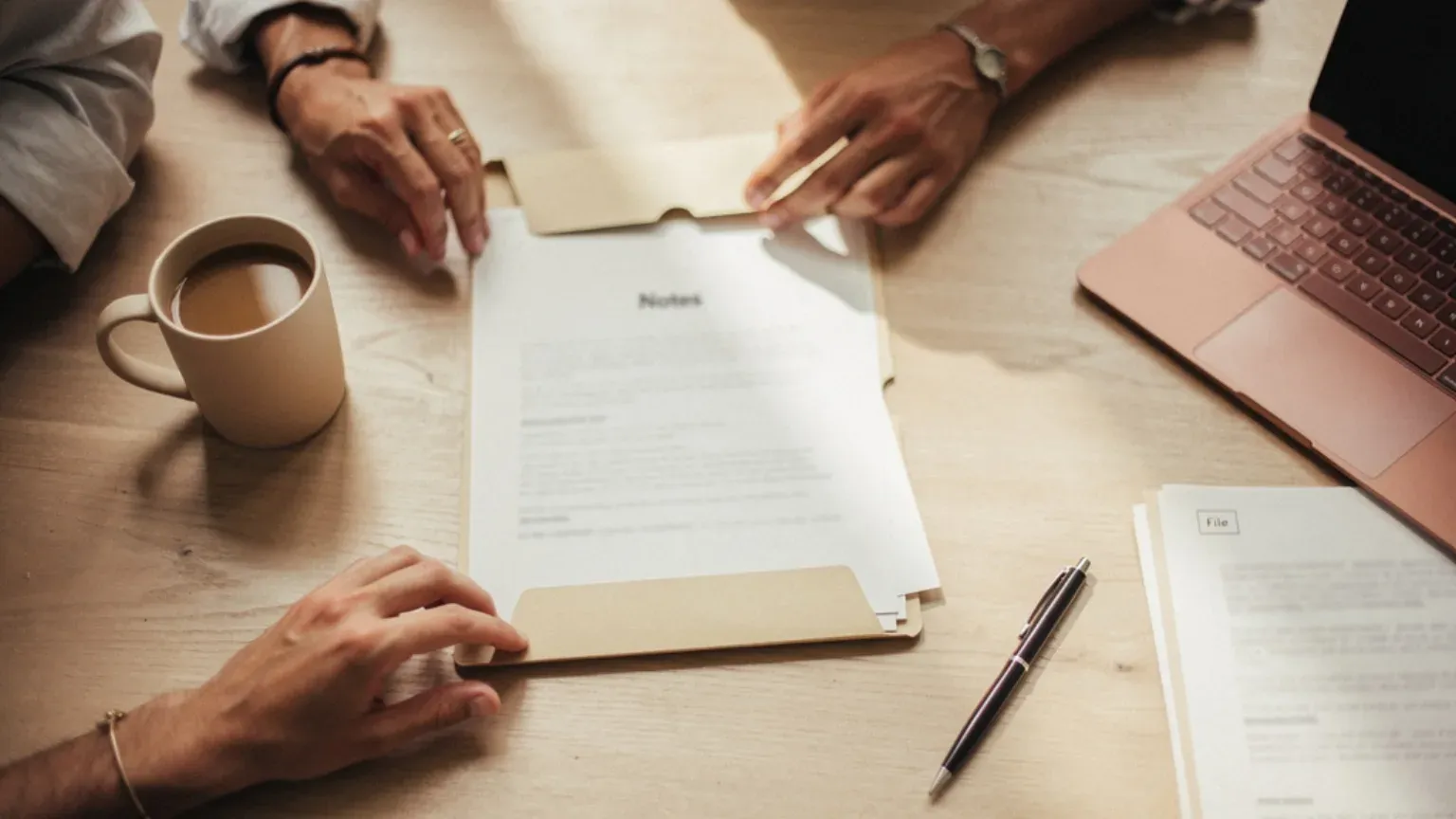 A workspace set up to review insurance and employer benefits.