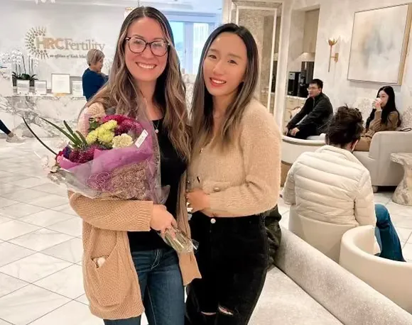 Intended parent couple reviewing surrogacy budget planning documents