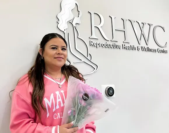 Prospective intended parent speaking with a coordinator about surrogacy costs