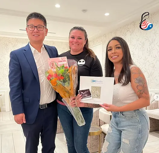 Parents and child representing family-building support for single parents and LGBTQ+ intended parents