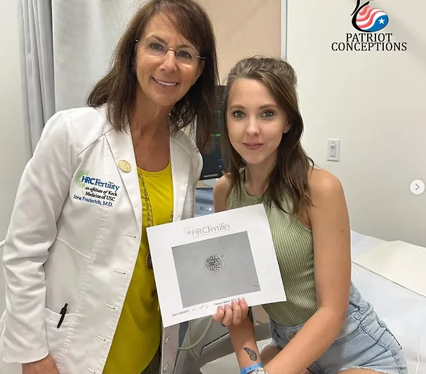 Intended parents holding a newborn after a coordinated surrogacy journey