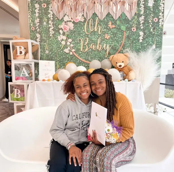 Surrogate candidate with intended parents during a family-building meeting